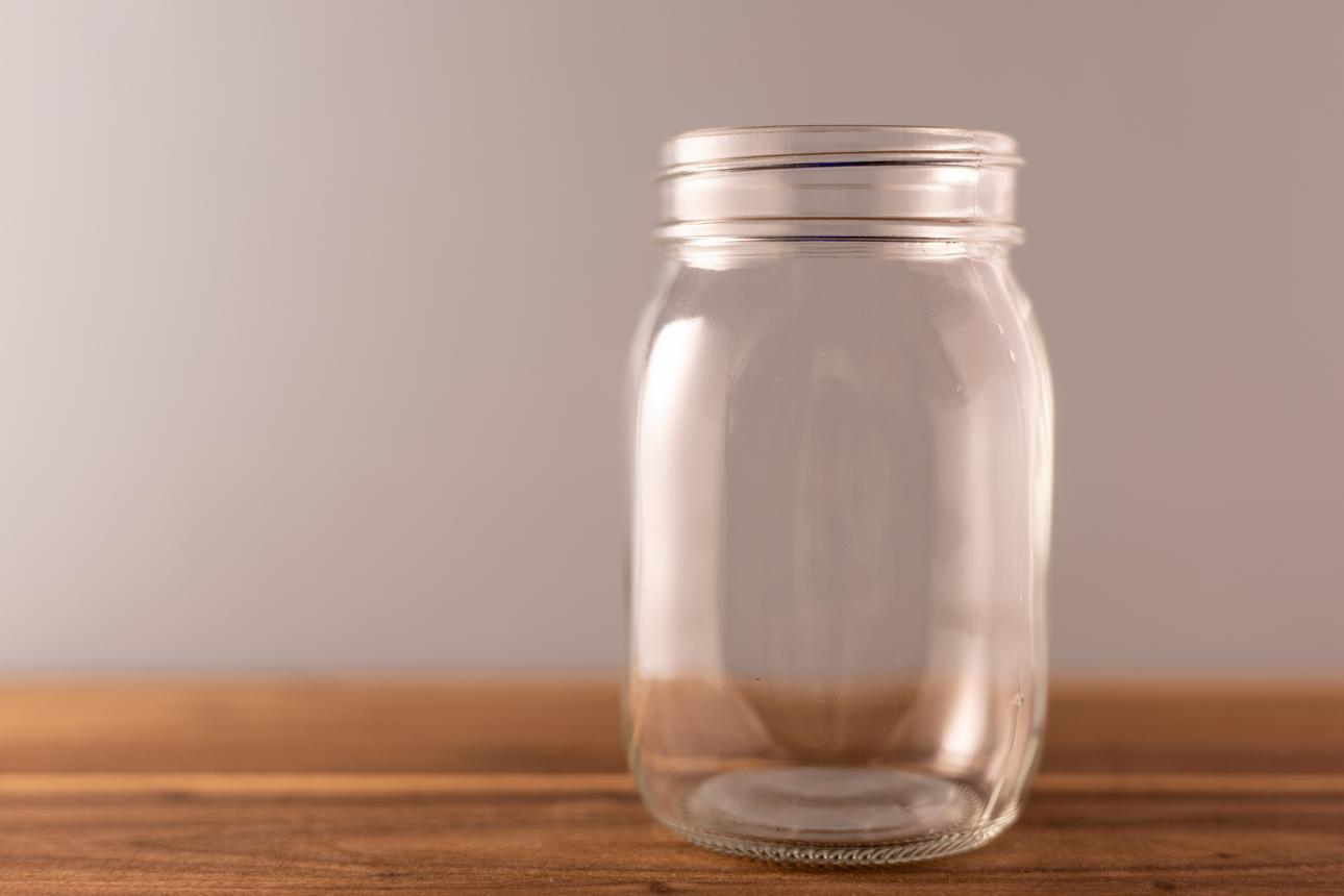 Empty Glass Jar on Wooden Surface