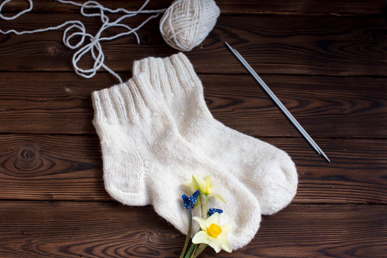 Knitted white wool socks. Handmade in rustic style