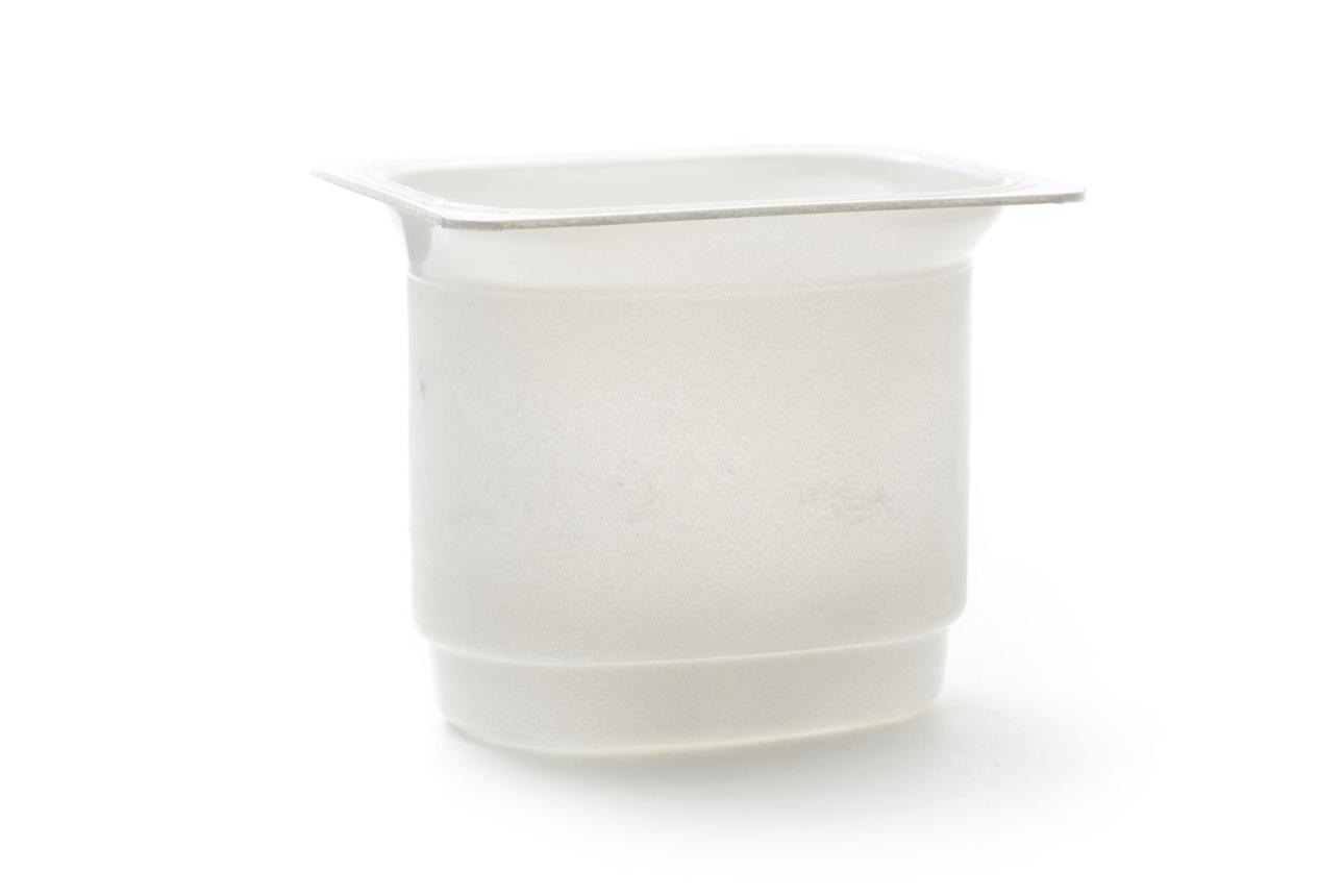 Empty plastic yoghurt pot on white