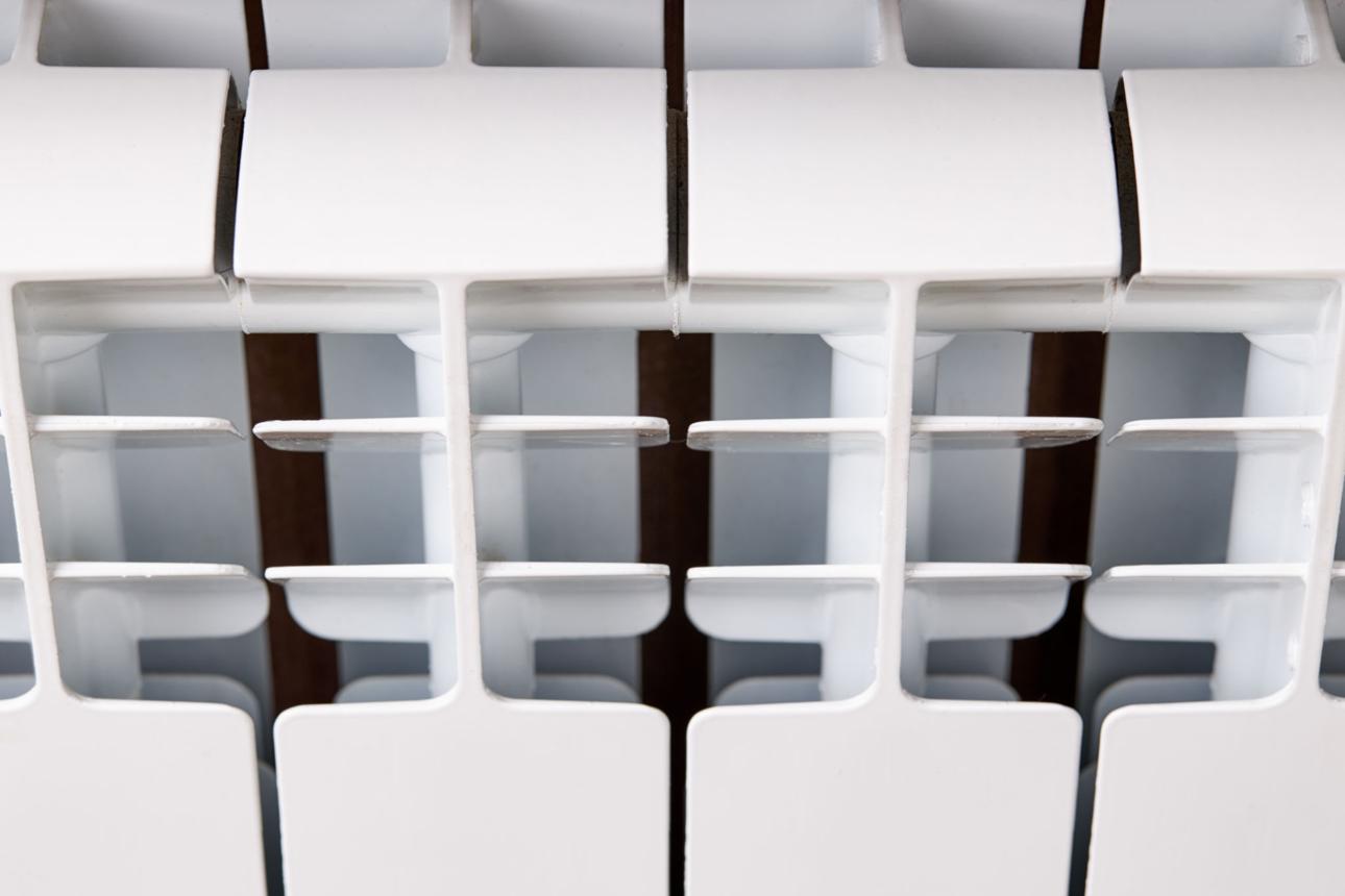 close up view water aluminium radiator. central heating system at winter season